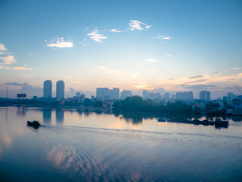 body of water near city buildings during daytime