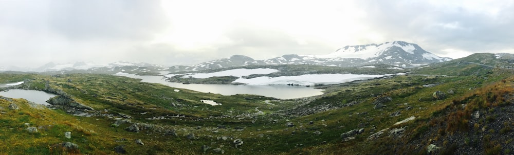 a view of a mountain range with a lake in the middle