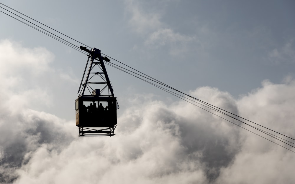 black cable car under blue sky