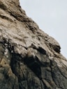 brown rocky mountain under white sky during daytime