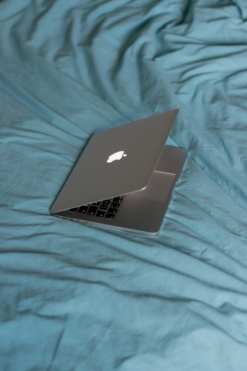 macbook air on pink textile