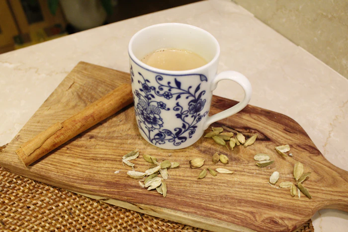 Ceramic mug of chai on a wooden table