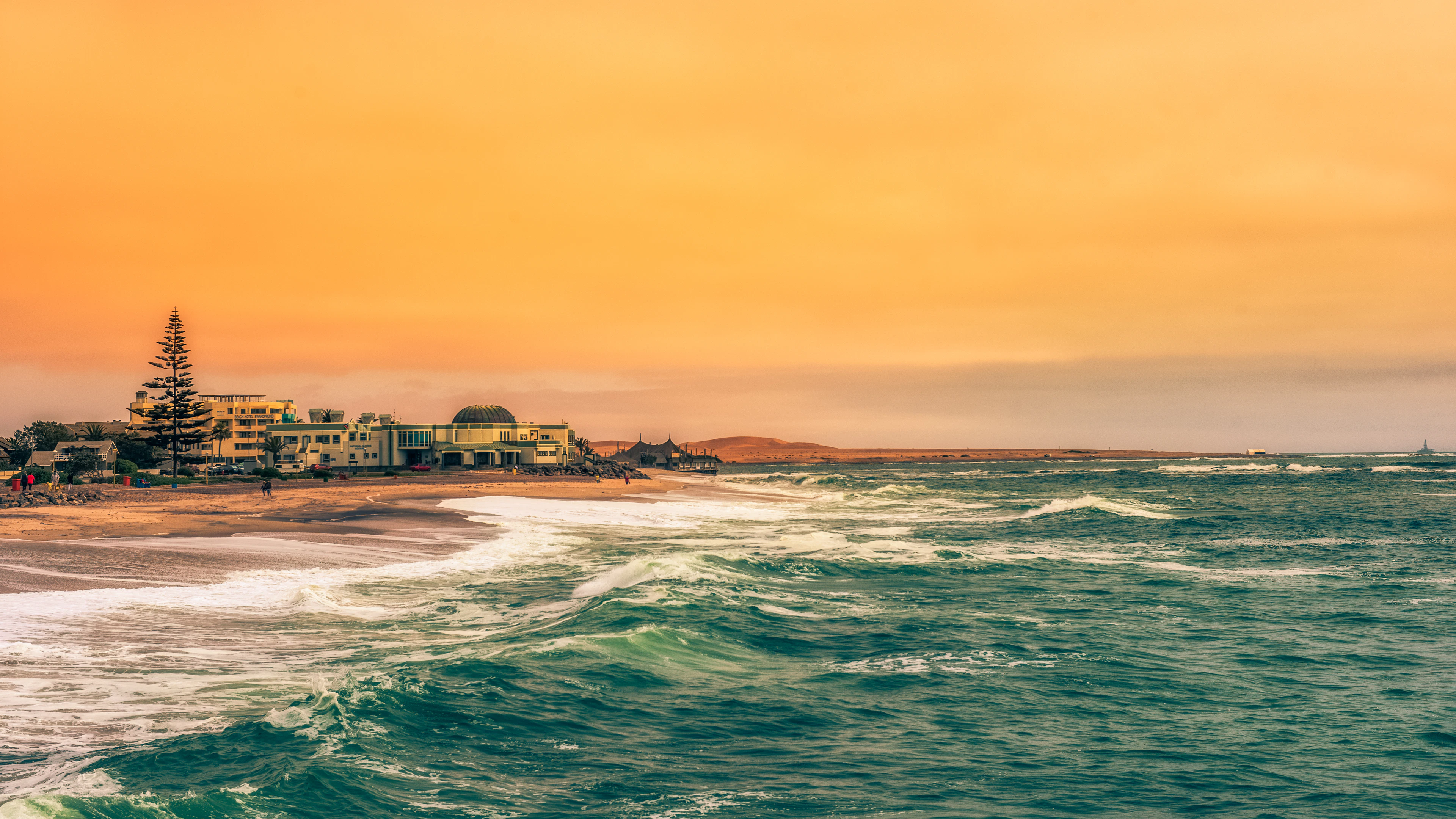 Swakopmund's seafront and buildings in the evening light, with Atlantic waves