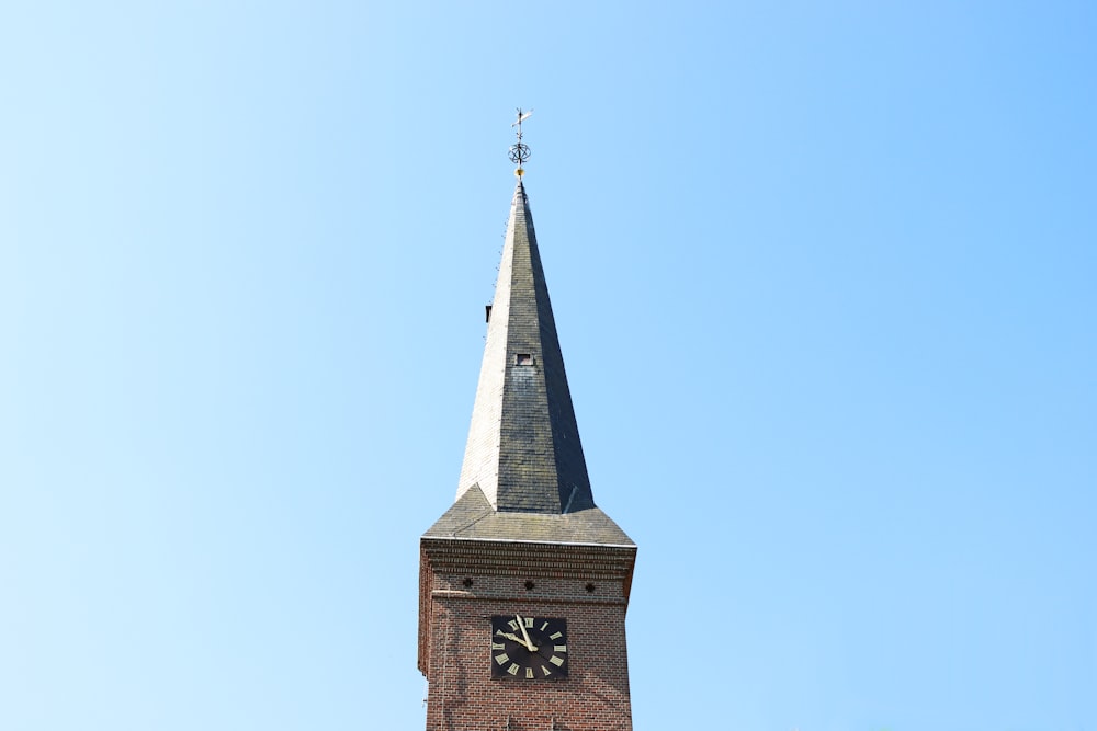 brown concrete tower with clock