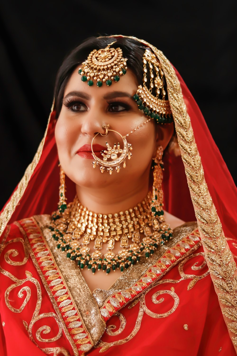 woman in gold and red sari