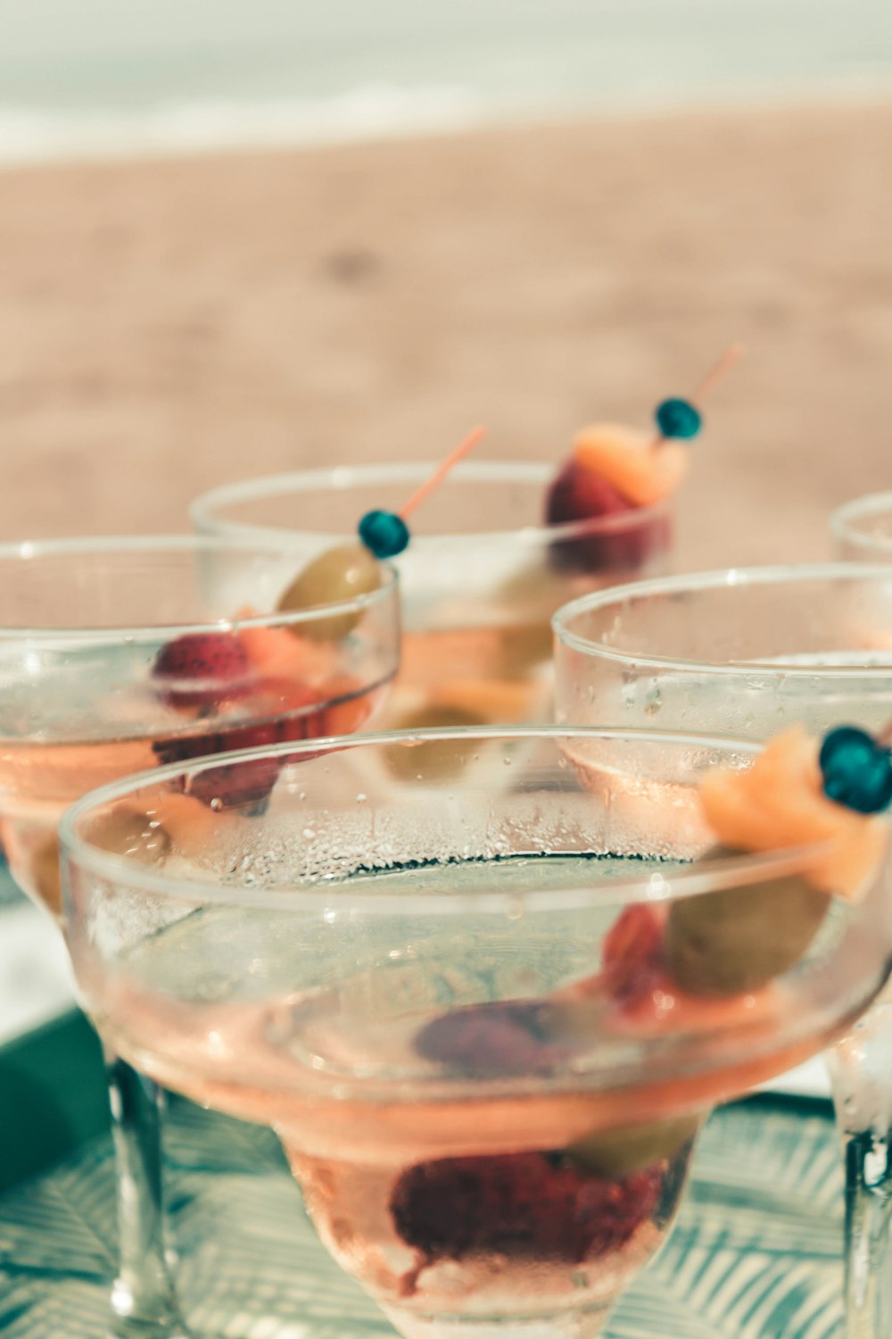 clear drinking glass with red and orange candies