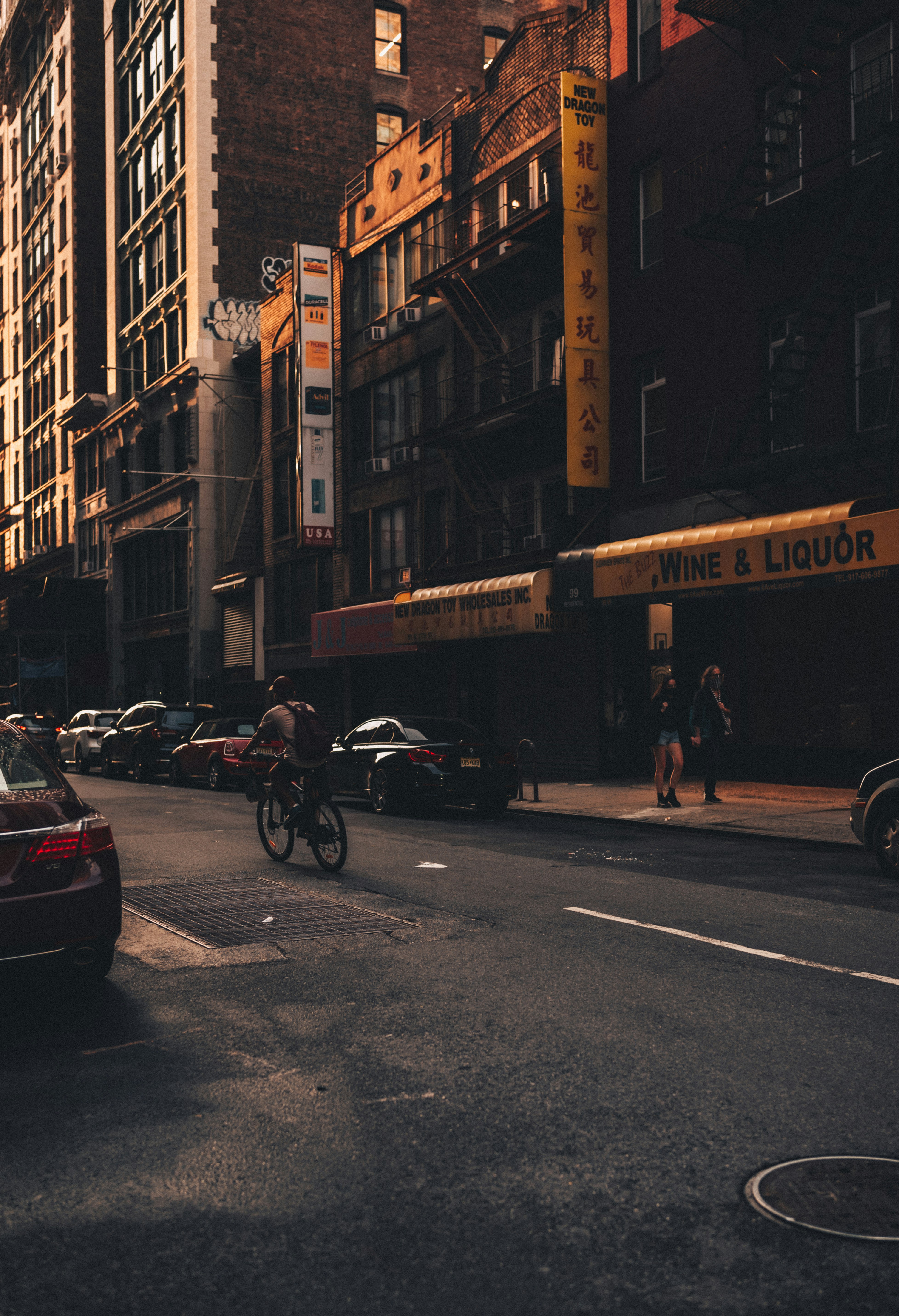 people riding motorcycle on road near buildings during daytime