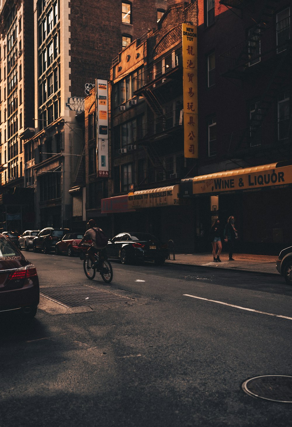 people riding motorcycle on road near buildings during daytime