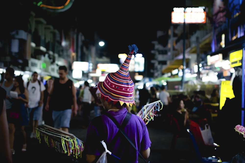 people walking on street during night time