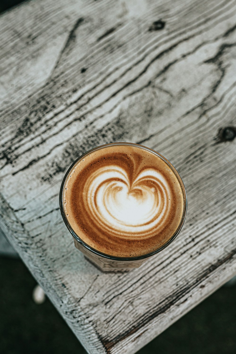 brown and white ceramic mug with coffee