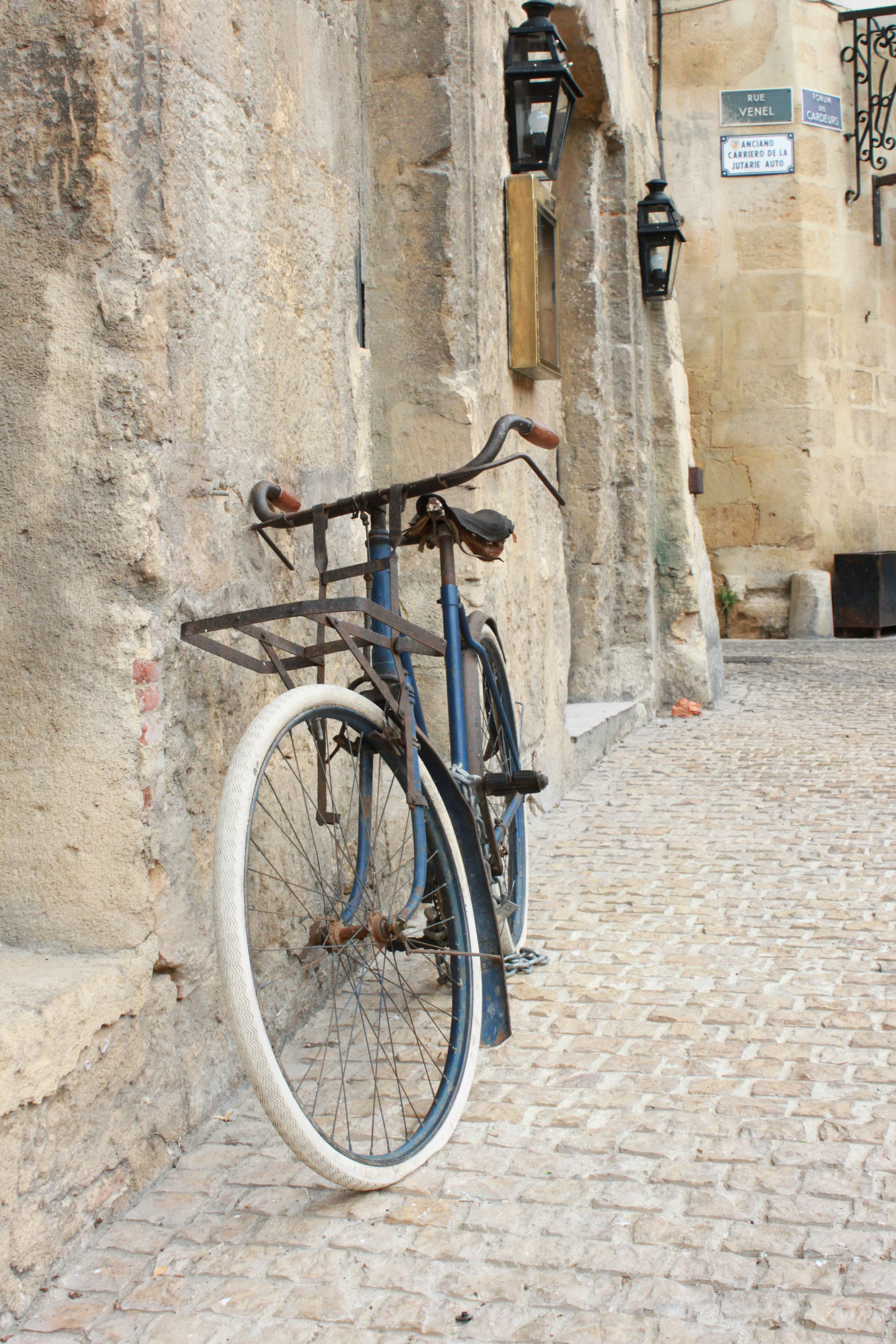 Old bicycle on an old wall in an old town. Captured at 16:15 on September 16th 2009 in Aix-en-Provence, France.