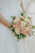 A close-up of a bride's bouquet with soft lighting.