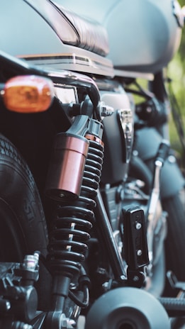 a close up of a motorcycle parked in a parking lot