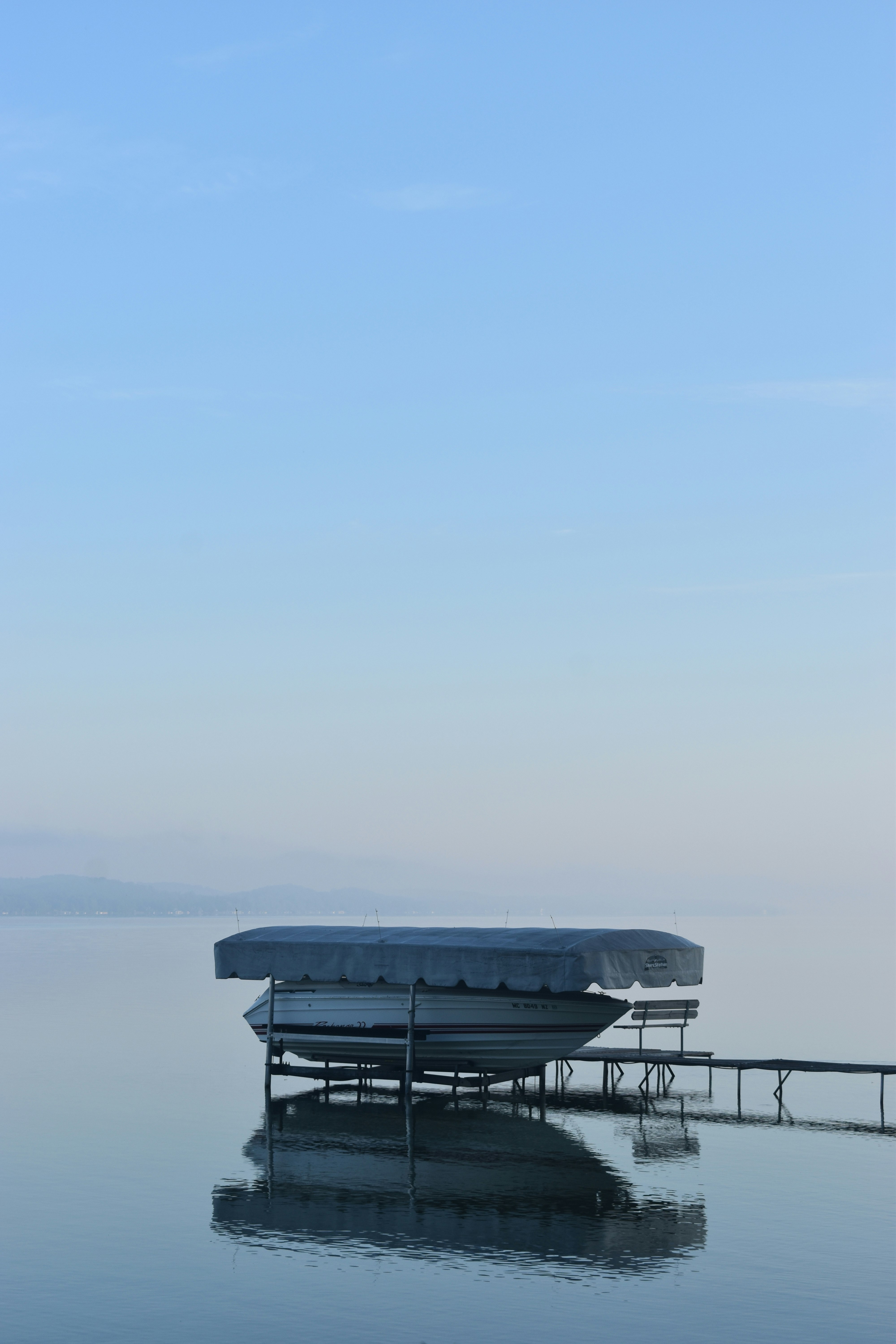 white and black boat on sea during daytime