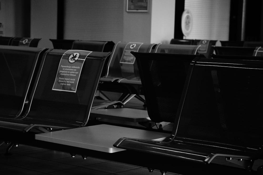 black laptop computer on black table