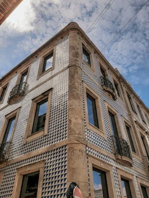 brown concrete building under blue sky during daytime