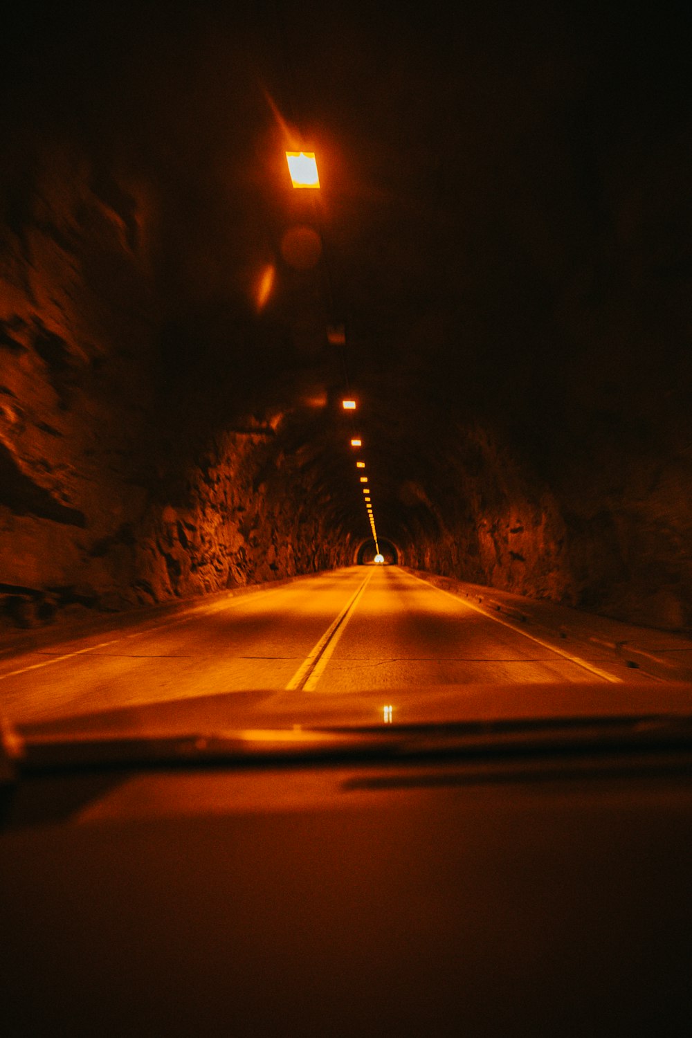 black car on road during night time