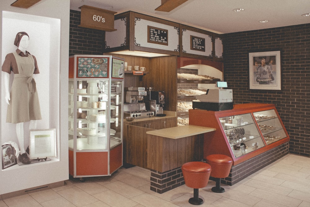 red and black bar stools beside brown wooden counter