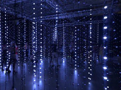 An immersive interactive installation blending music notes with digital light grids in a dark room.