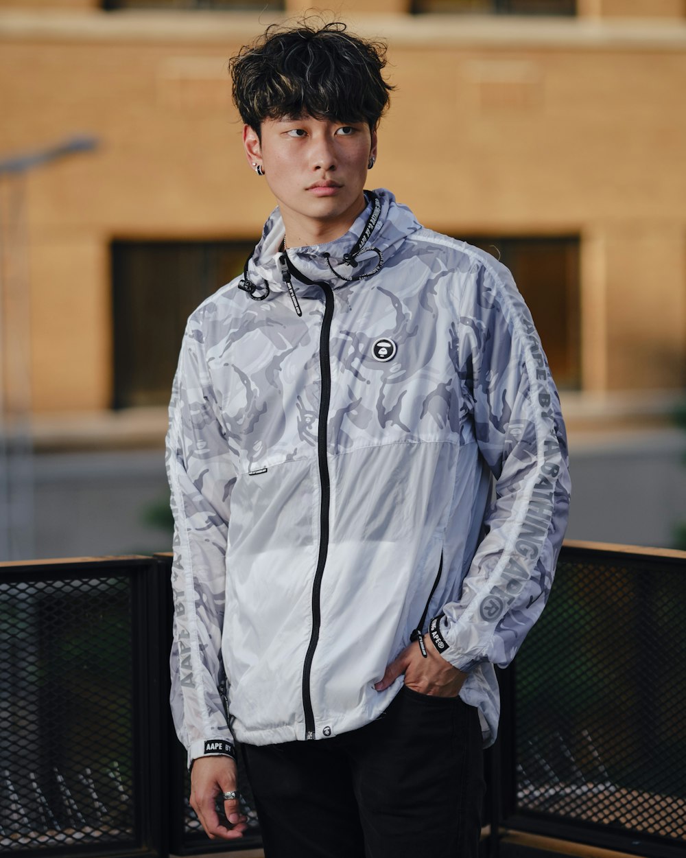 man in blue denim jacket standing