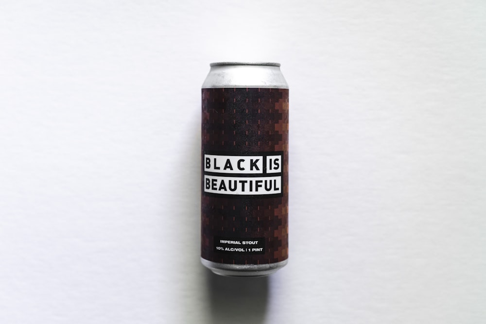 black and brown can on white table