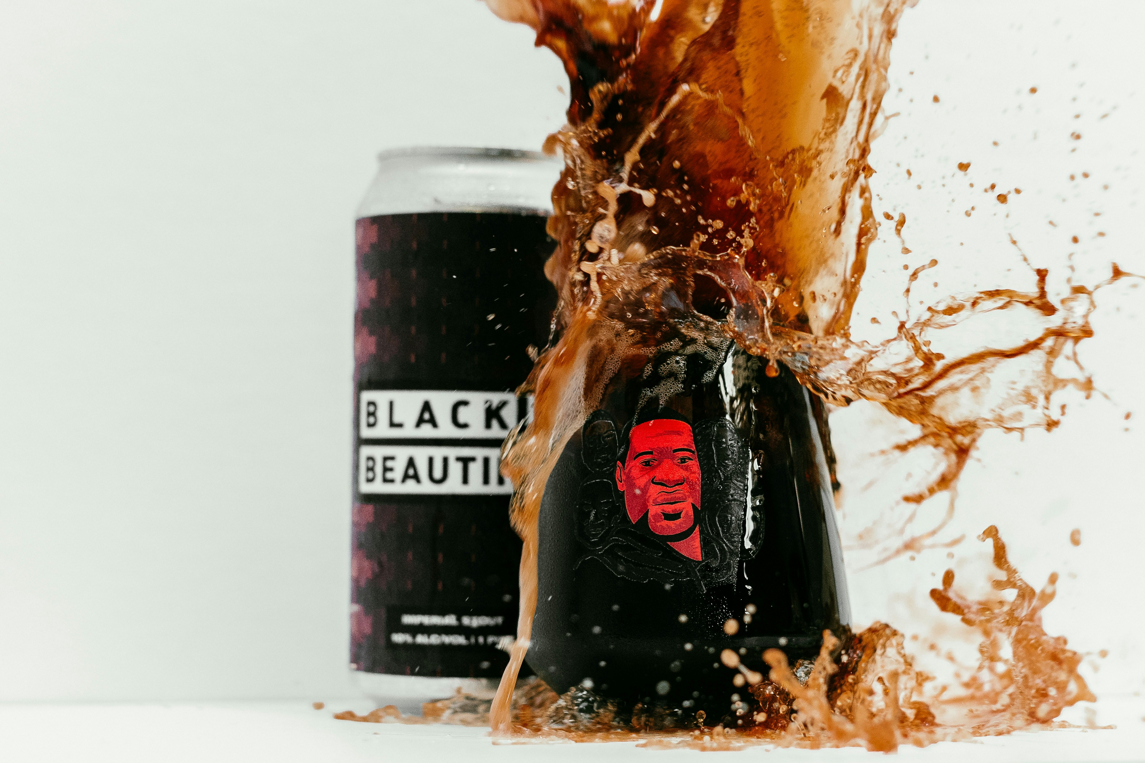 Black Is Beautiful Stout spilled into Beer Chronicles George Floyd glass. A beer brewed by Weathered Souls Brewing out of San Antonio, TX. This beer was born through the Black Lives Matter Movement, this is the Craft Beer Community's way of showing that we care. We love you. Black IS Beautiful. Read how this beer was born on our blog post at https://beerchronicle.com Link below.<br /><br />http://beerchronicle.com/weathered-souls-black-is-beautiful-beer-collaboration/