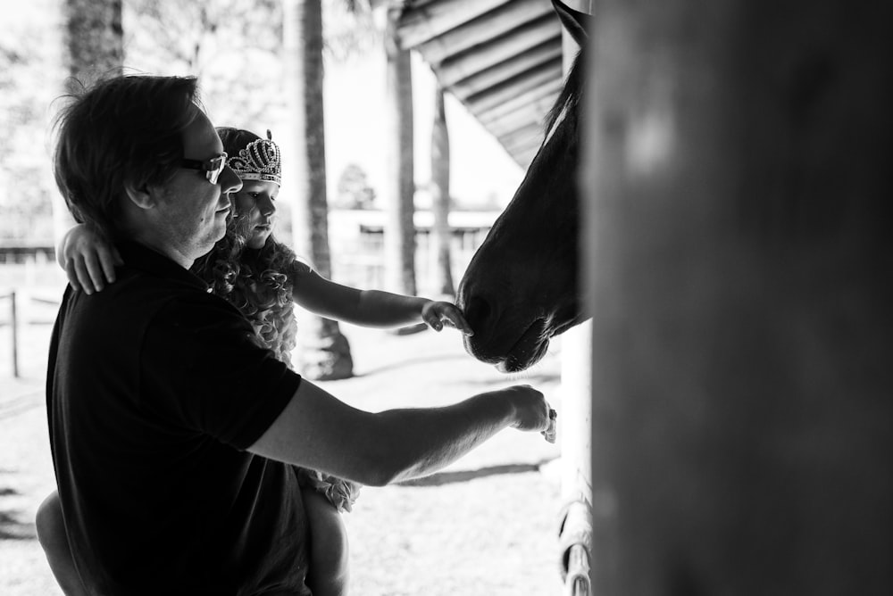 grayscale photo of woman in black shirt and black sunglasses