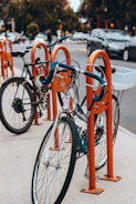 Electric bike lock secured to a bike rack in a busy street
