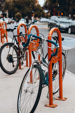 Electric bike lock secured to a bike rack in a busy street