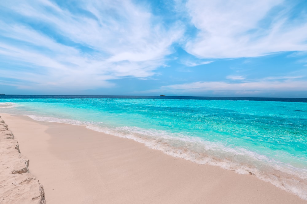 blue sea under blue sky during daytime