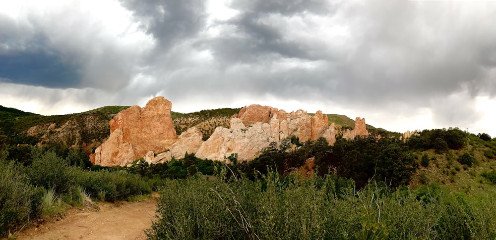 brown rock formation under cloudy sky during daytime