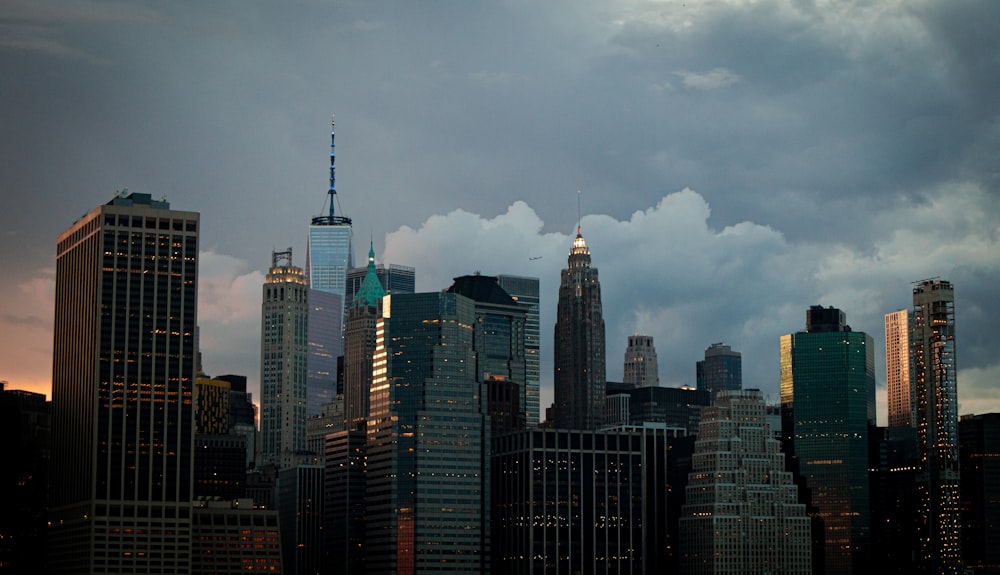 city skyline under cloudy sky during daytime
