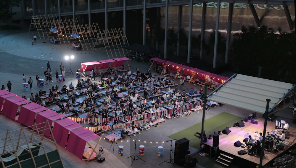 people sitting on chairs inside stadium