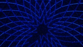A geometric pattern made up of interconnected triangular shapes illuminated with a vivid blue light, creating a mesmerizing, kaleidoscope-like effect. The design converges towards the center, forming a circular motif.