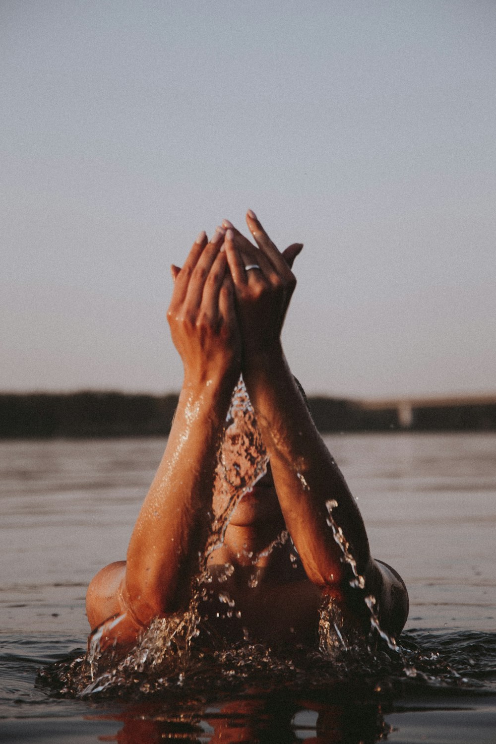 persons feet on water during daytime