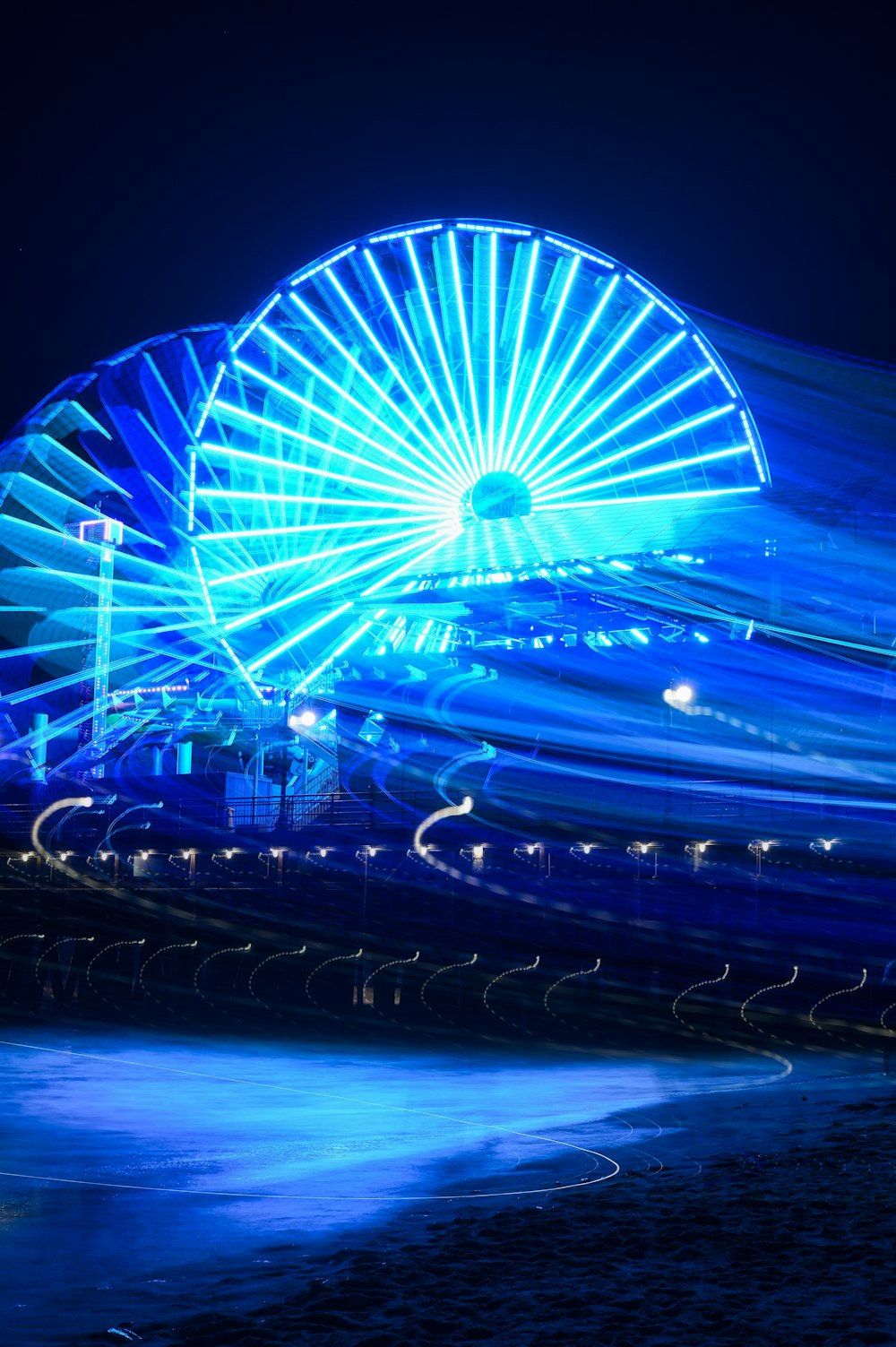 ferris wheel with lights turned on during night time