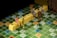 Miniature figurines are positioned on a Scrabble board, with yellow tile stacks spelling out 'NO L...ING'. The scene appears playful and imaginative, as the miniatures mimic real-life interactions in a board game setting.