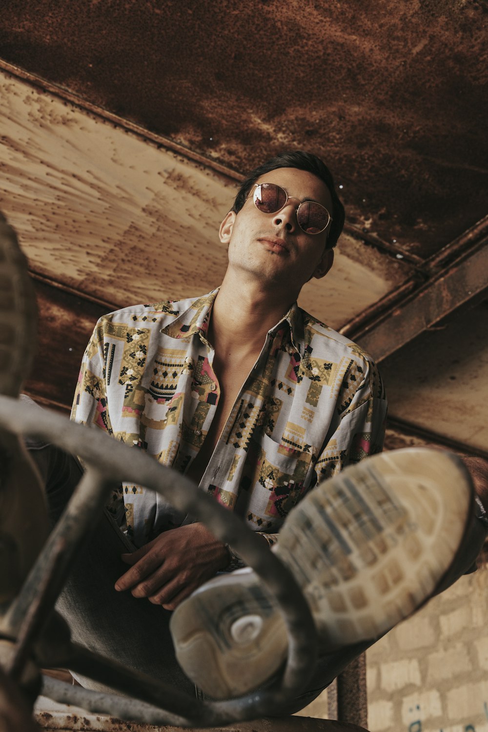 man in white and blue button up shirt wearing black sunglasses