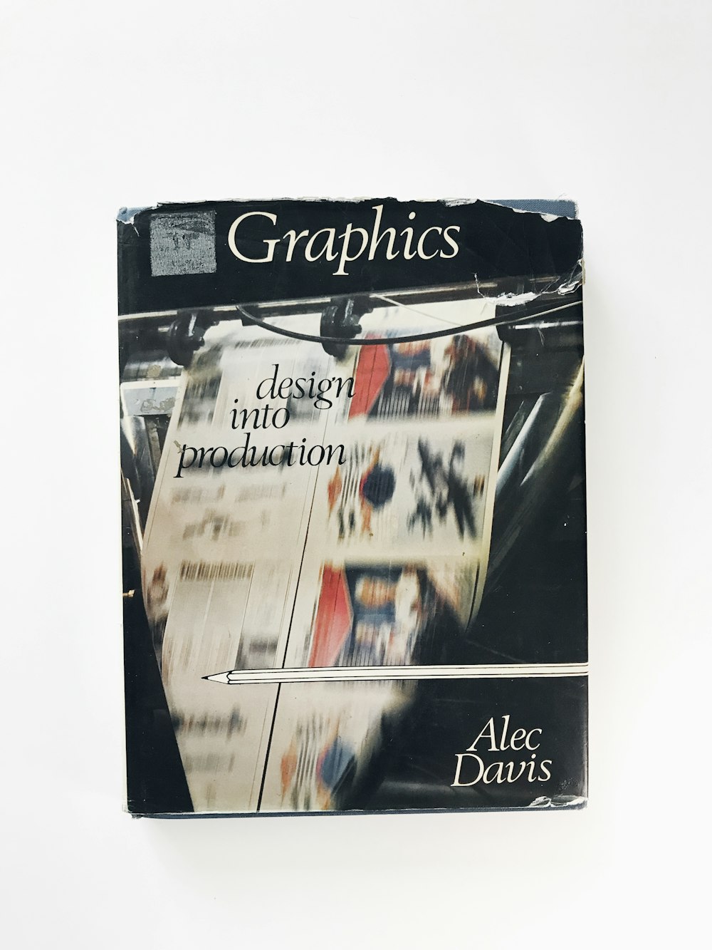 a book with a picture of a newspaper on top of it
