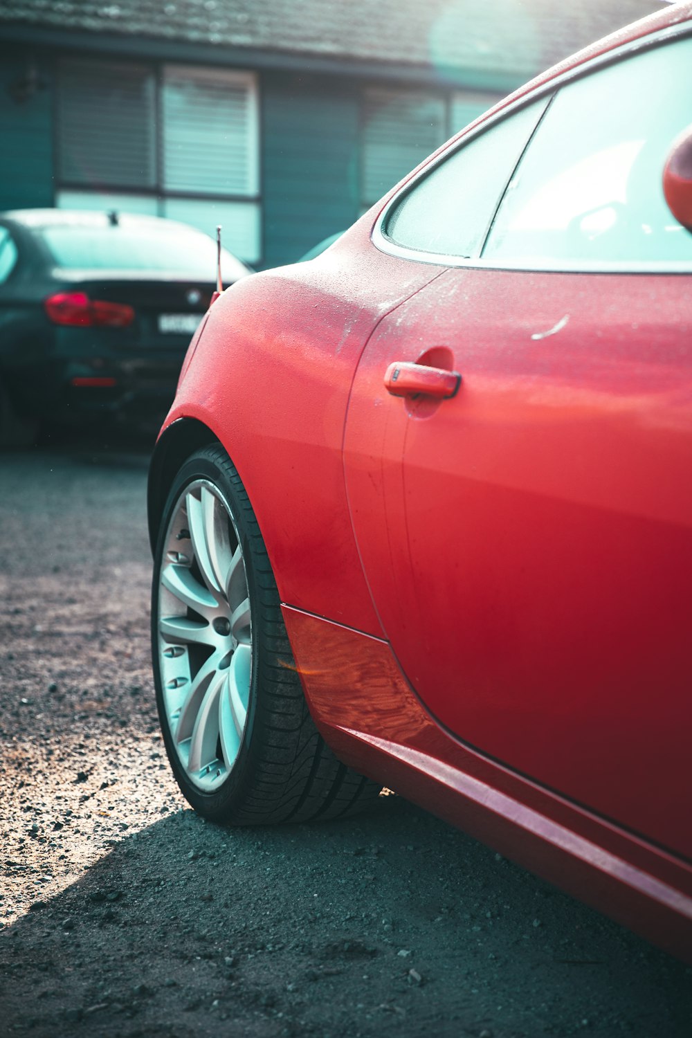 red car parked on the side of the road