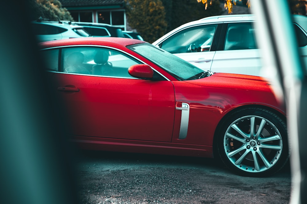 red porsche 911 parked on road during daytime