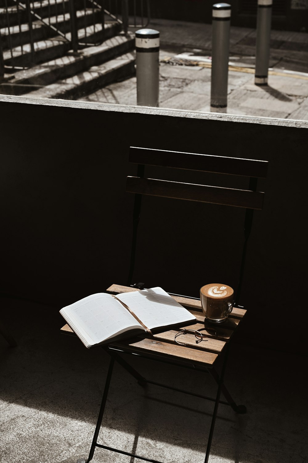 white book on brown wooden table