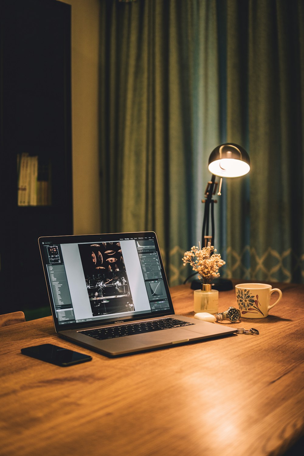 macbook pro on brown wooden table