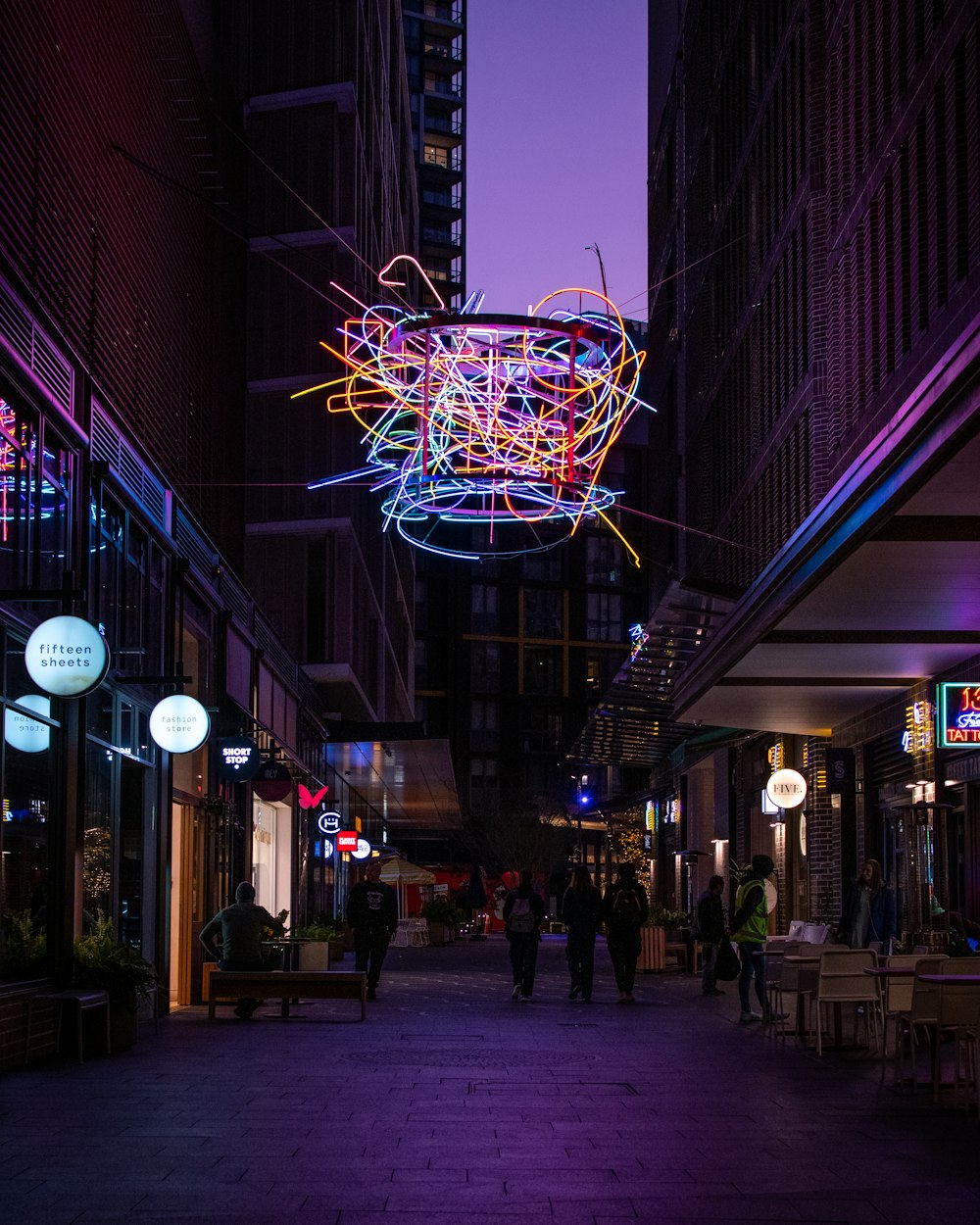 people walking on street during nighttime