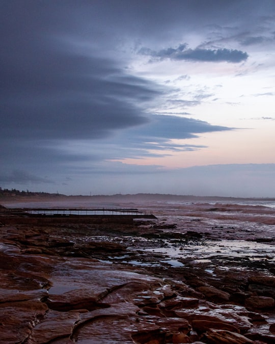 body of water under cloudy sky during daytime in Cronulla NSW Australia