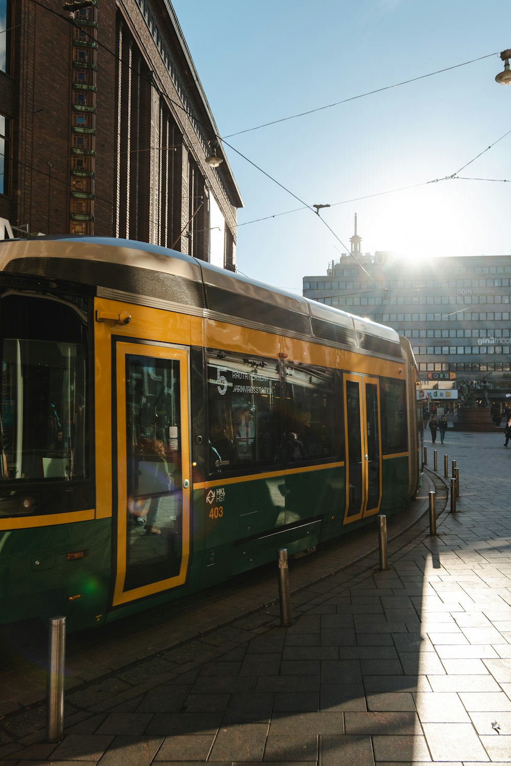 white and green train on rail road during daytime