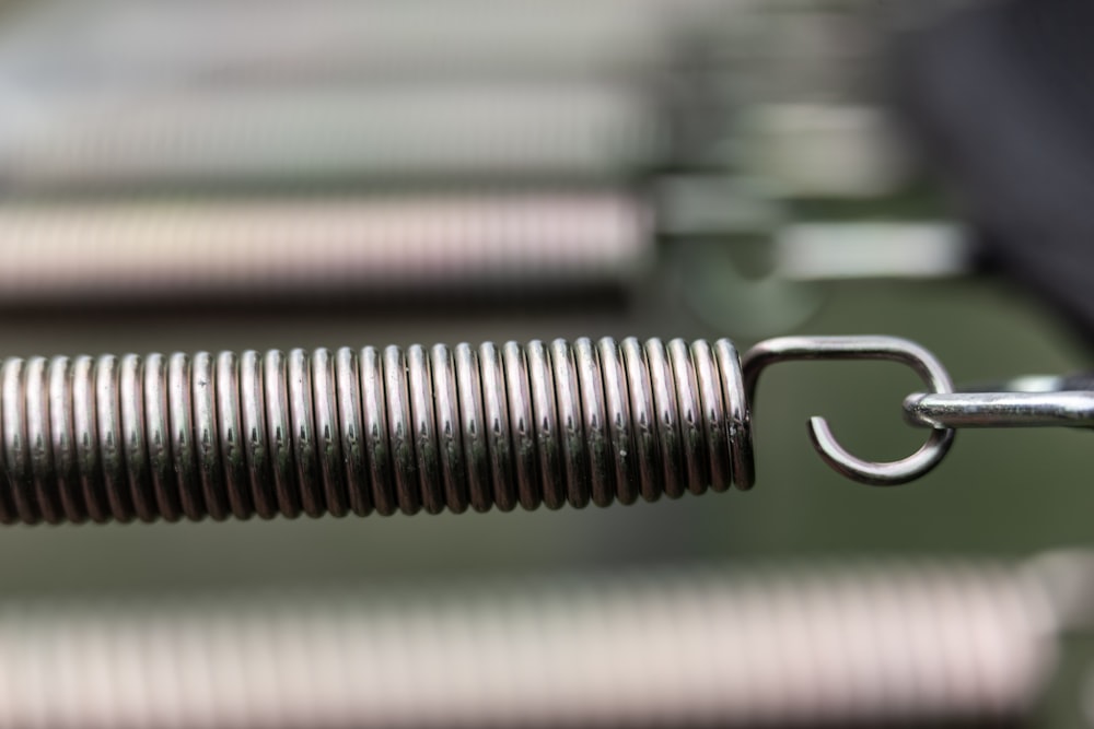 silver steel tube on white and green stripe textile