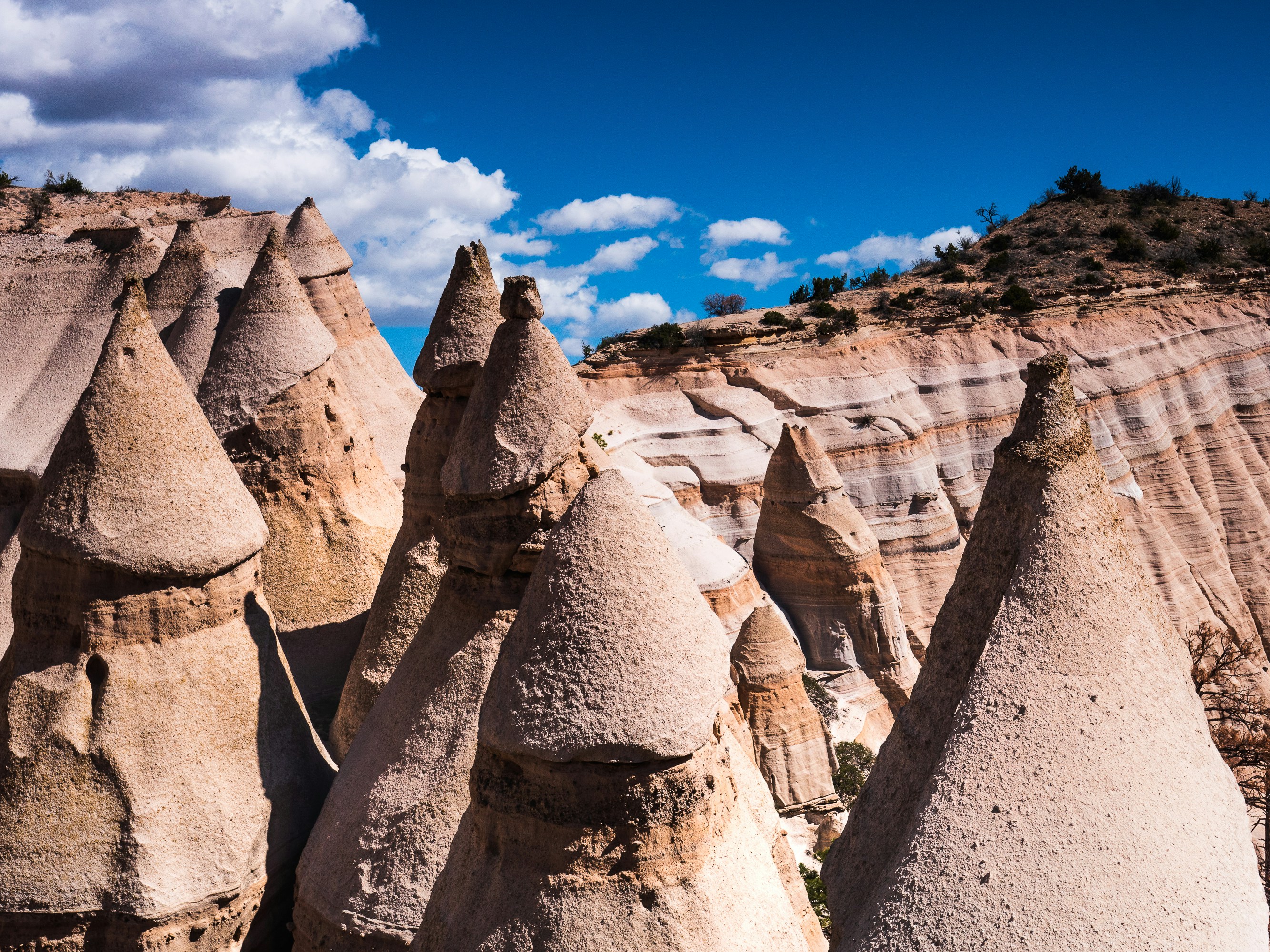 Stop image for Santa Fe to Monument Valley: 3-Day Desert Journey - brown rock formation under blue sky during daytime -  in Southwest USA - Photo by Raychel Sanner on Unsplash
