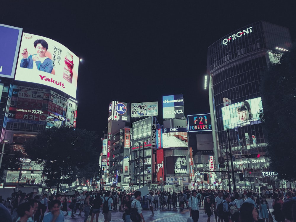 people walking on street during nighttime