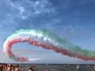 people on beach under blue sky with pink clouds during daytime